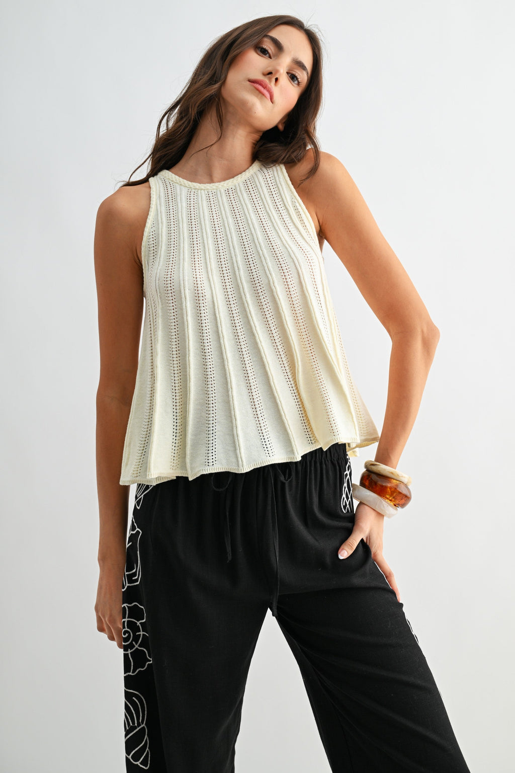 Sleeveless Knit Top With Flared Hem - Pendo Store