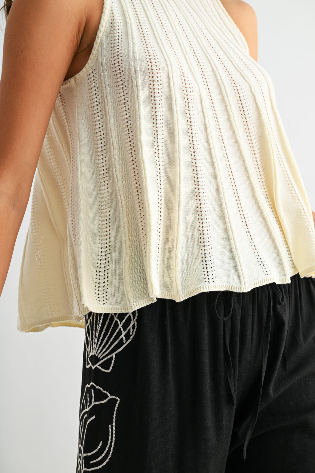 Sleeveless Knit Top With Flared Hem - Pendo Store